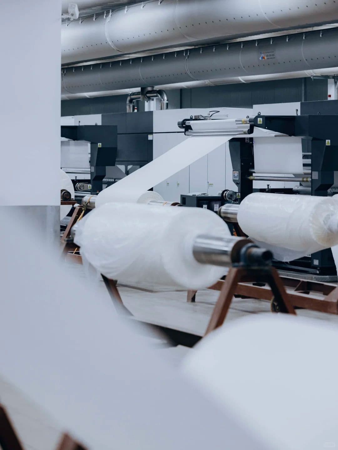 Fabric rolls moving through the finishing line